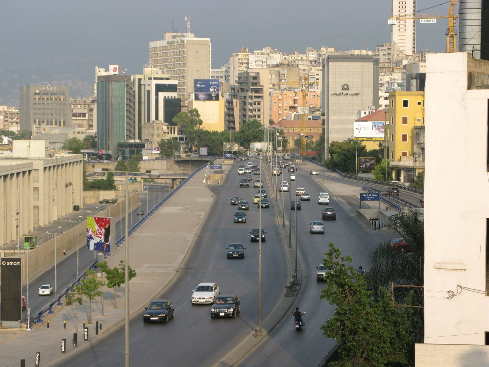 Central Beirut photographed from the port area, apartment blocks and a main road running inland.